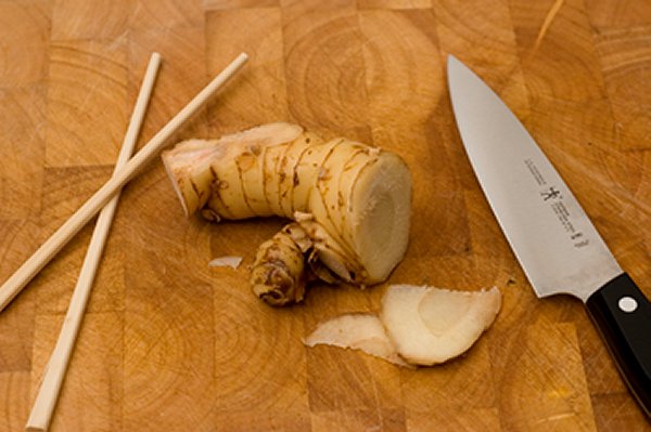 Fresh galangal root is hard and requires care and a sharp knife to slice it